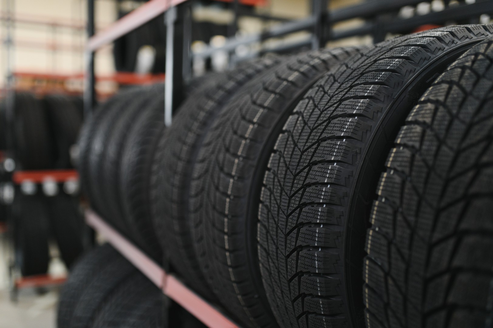 New car tire is placed on the tire storage rack in the tire factory.